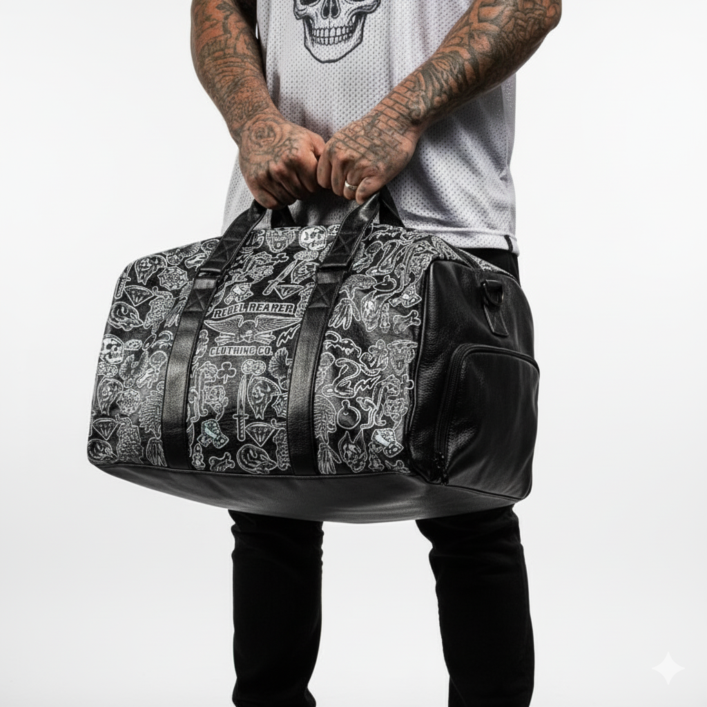 Person holding a black and gray patterned duffel bag against a white background