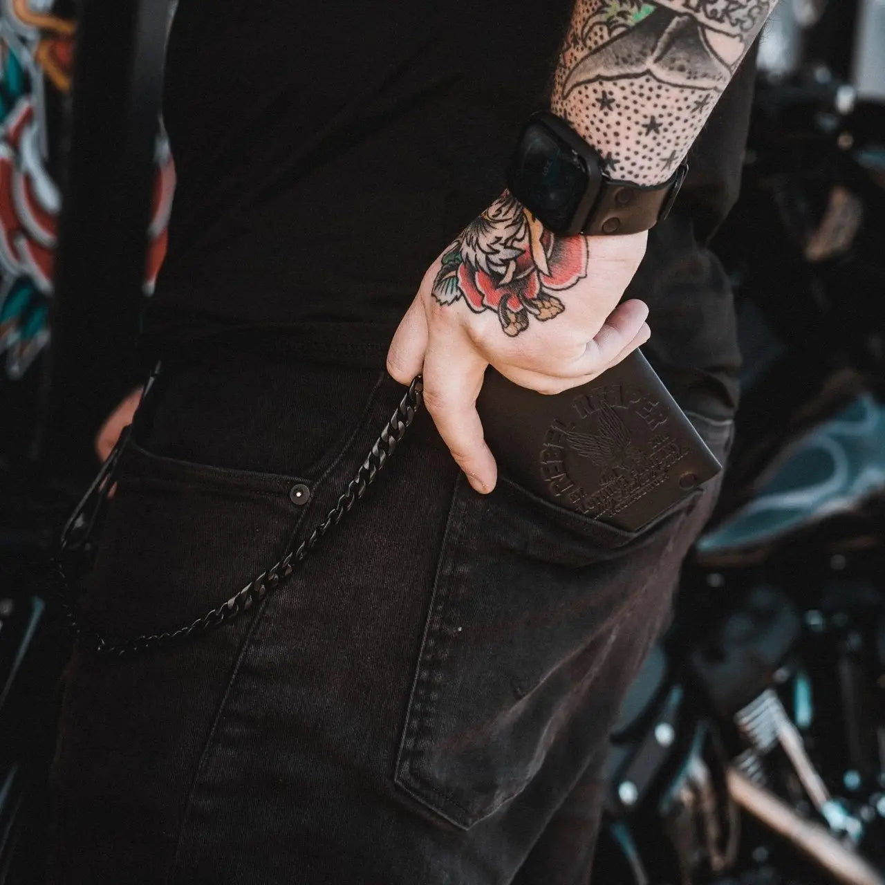 Black leather wallet with chain from Rebel Reaper accessories collection featuring moto bags