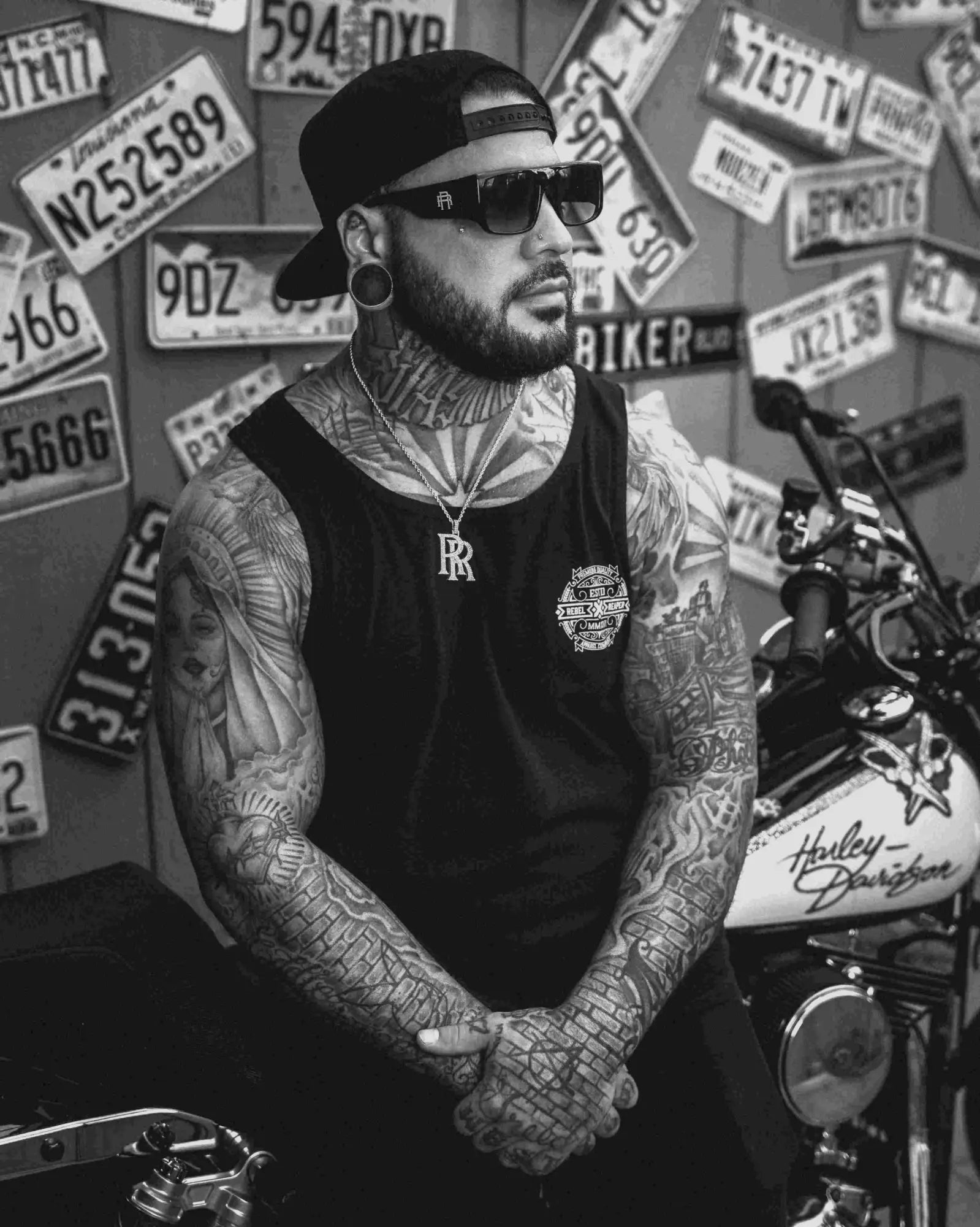 Rebel Reaper Mens tattooed man with sunglasses and motorcycle in Rebel Reaper Mens collection