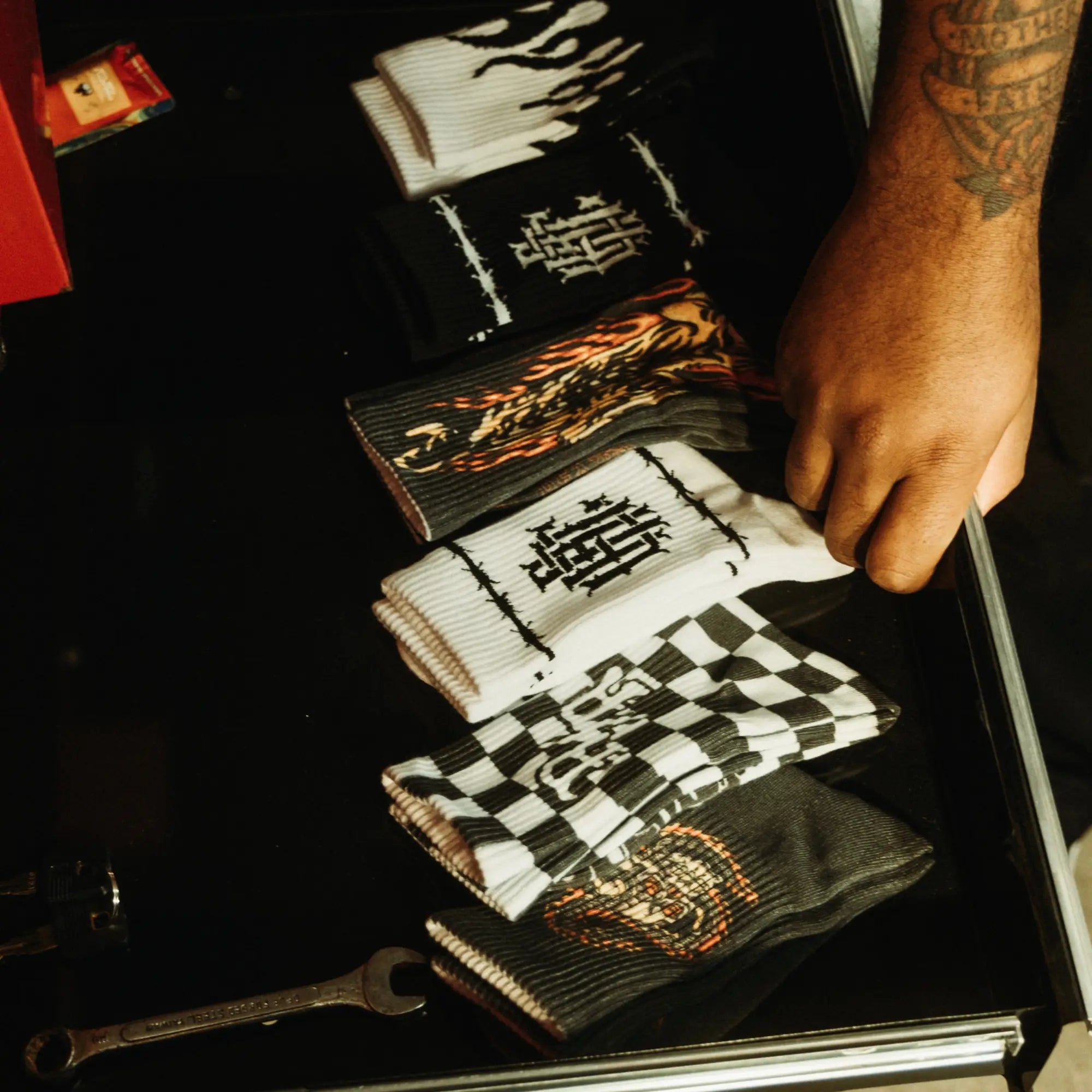 Colorful assorted graphic socks collection featuring womens socks, mens socks, and rebel reaper socks