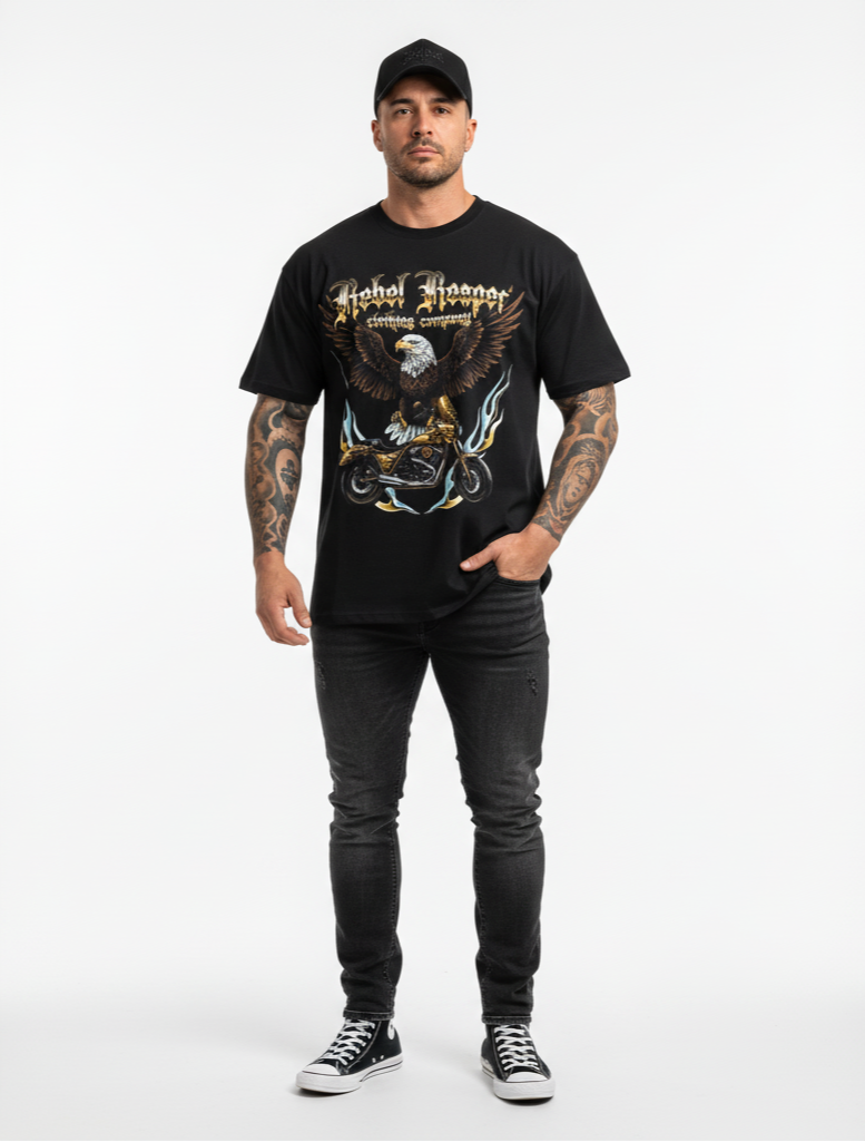 Man wearing a black t-shirt with an eagle graphic and text, standing against a white background