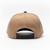 Beige baseball cap with black adjustable strap on a white background