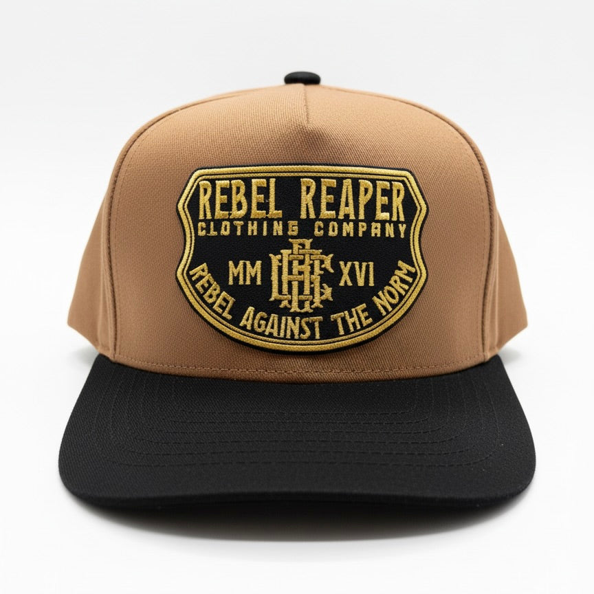 Tan and black cap with 'Rebel Reaper Clothing Company' logo on a white background