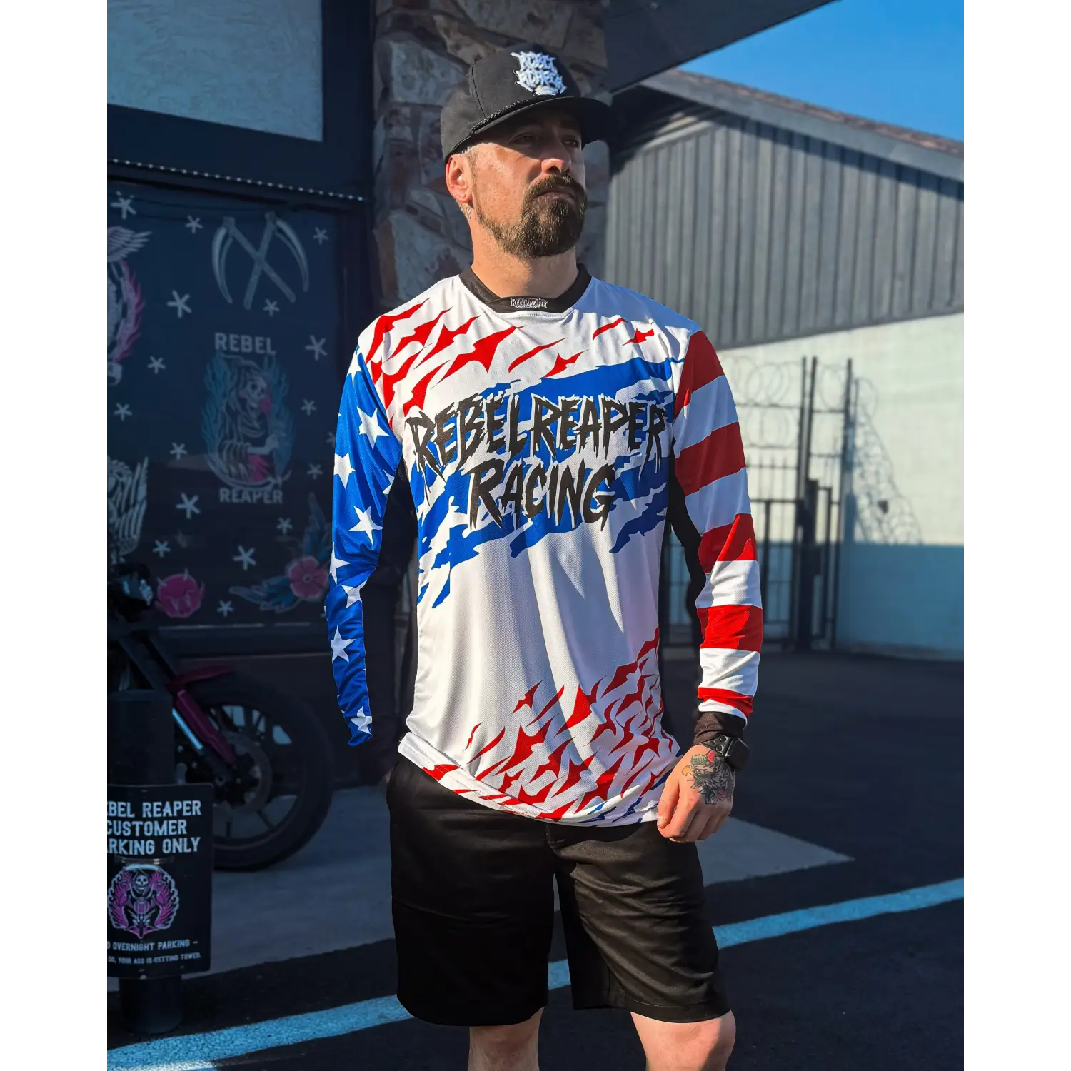 Man wearing rebel reaper racing jersey and black shorts from fly high blow past edition