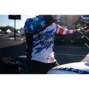 Patriotic motorcycle rider wearing Rebel Reaper Racing fly high Never Lose Crew jersey