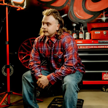 Man with mullet wearing Anaglyph Mens Flannel Shirt made of premium fabric featuring rebel reaper design