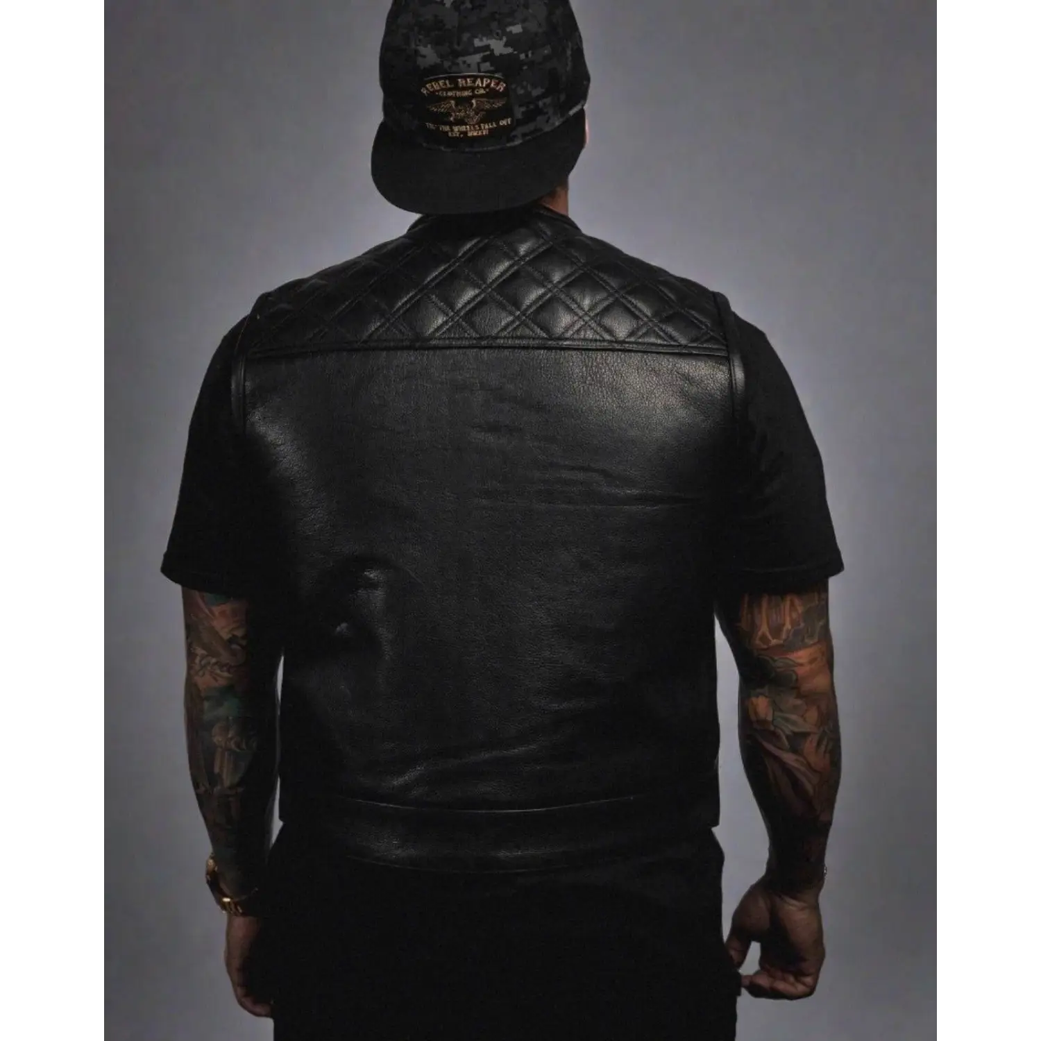 Black leather vest with quilted shoulders, YKK zippers, perfect for short torso style