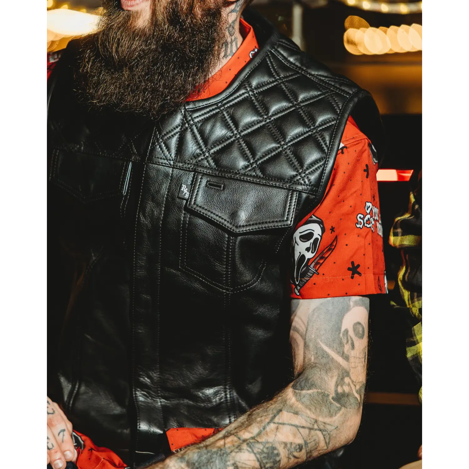 Black leather quilted vest with concealed carry pockets and double diamond stitching