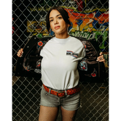 Woman in casual attire wearing a Back In Black women’s cowhide leather vest with conceal carry pockets