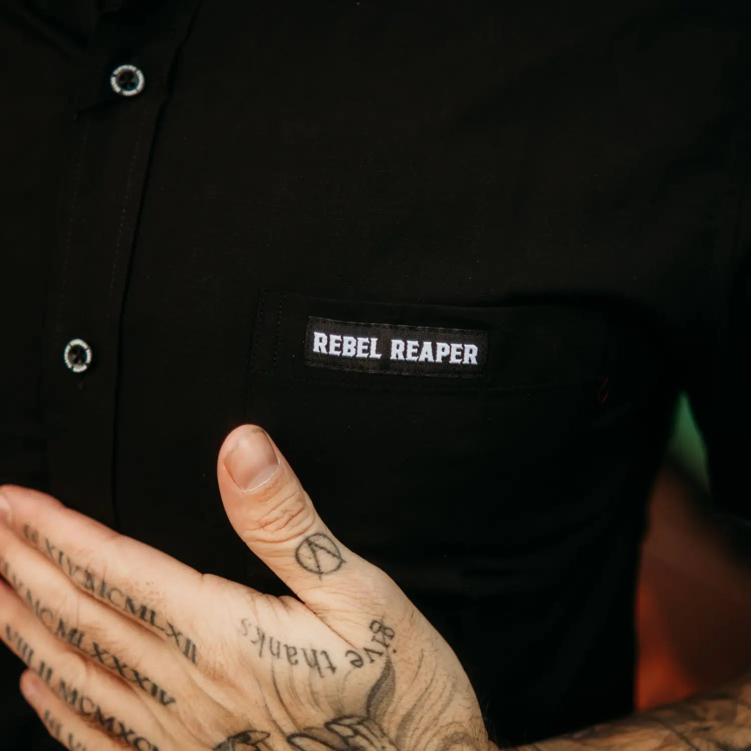 Black Bamboo Button Up Shirt S/S with Black shirt featuring Rebel Reaper patch and hidden collar buttons