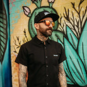 Man wearing Black Bamboo button-up shirt with hidden collar buttons in wrinkle-resistant bamboo fabric