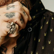 Black shirt with yellow metal hands and rock hand pattern, breathable materials, hidden collar buttons