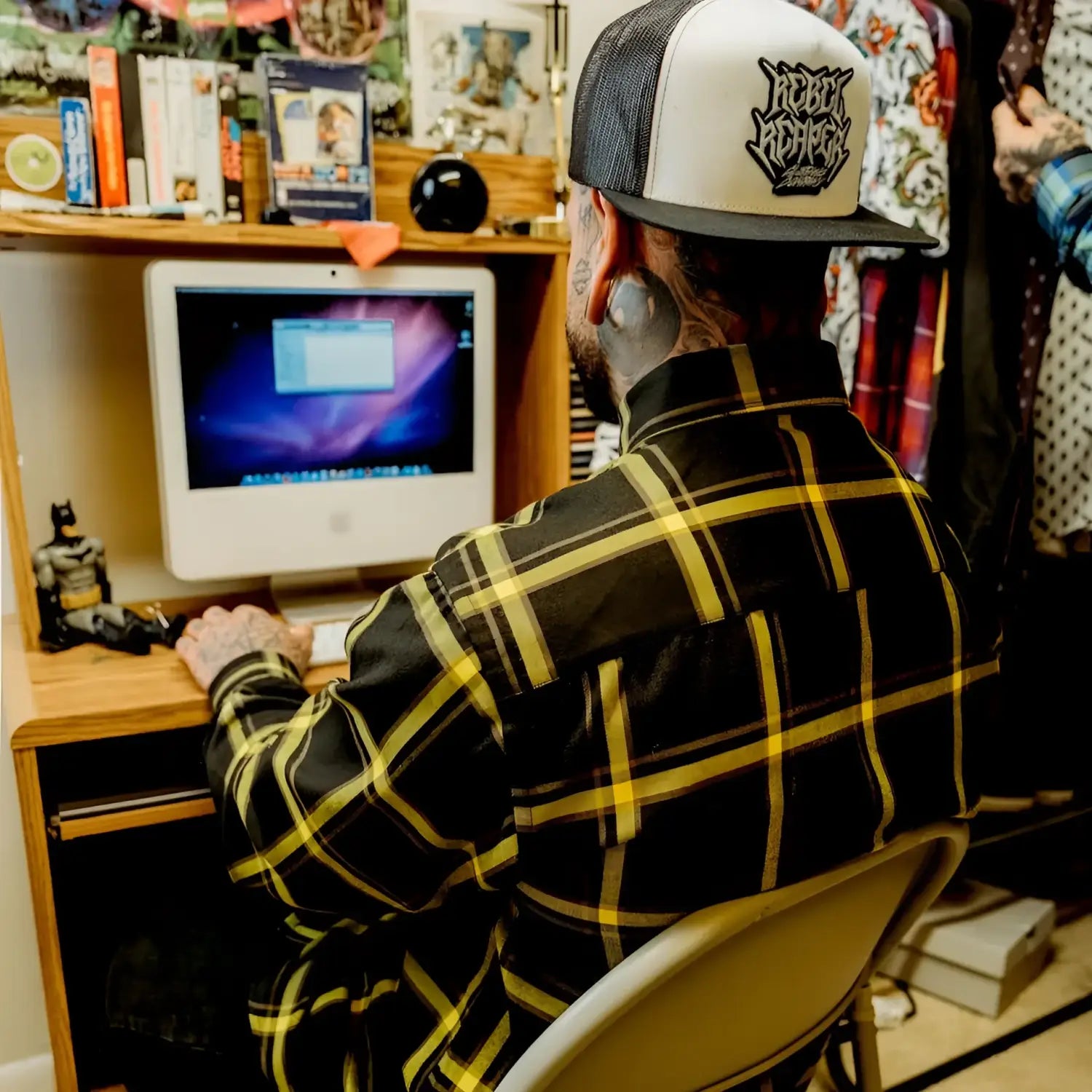 Man using iMac wearing Burgh Flannel Shirt Rebel Reaper exclusive design
