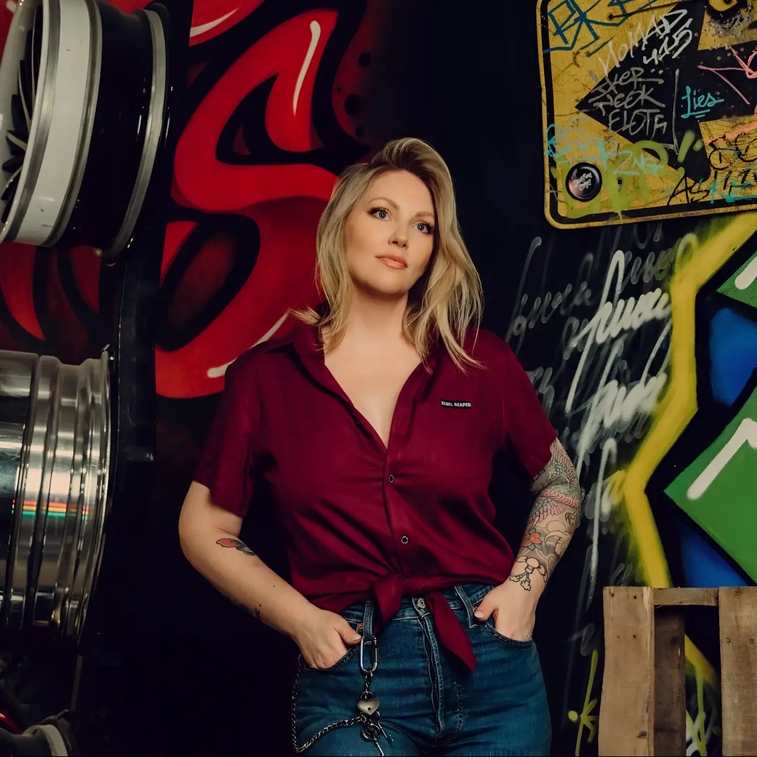 Woman in maroon bamboo short sleeve button-up shirt with hidden collar buttons