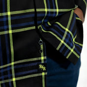 Black plaid Burton men’s flannel shirt with hidden collar buttons and chest pocket slits