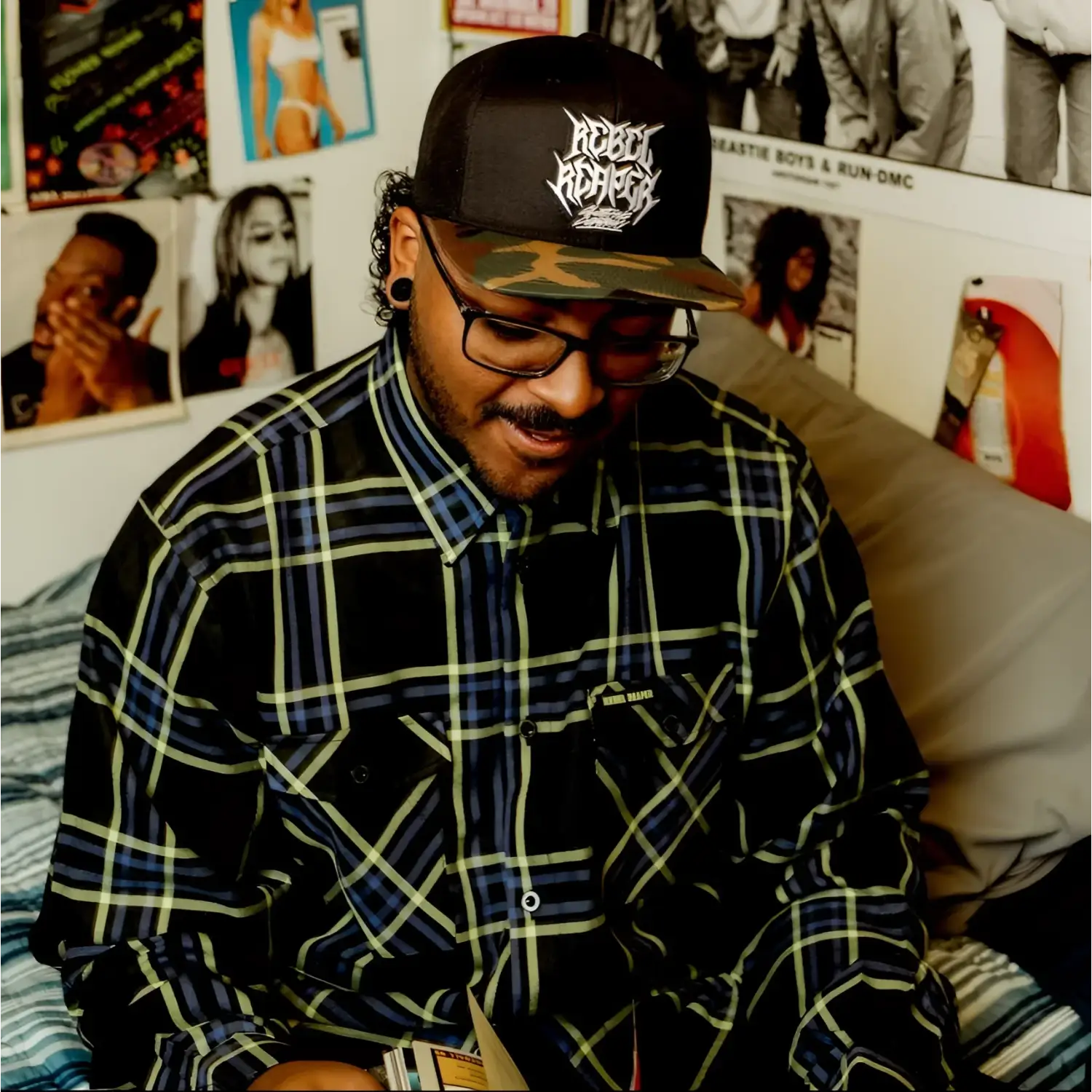 Man in plaid Burton Men’s Flannel shirt with hidden collar buttons and chest pocket slits