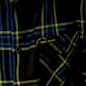 Burton Men’s Flannel with plaid pattern, chest pocket slits, and hidden collar buttons