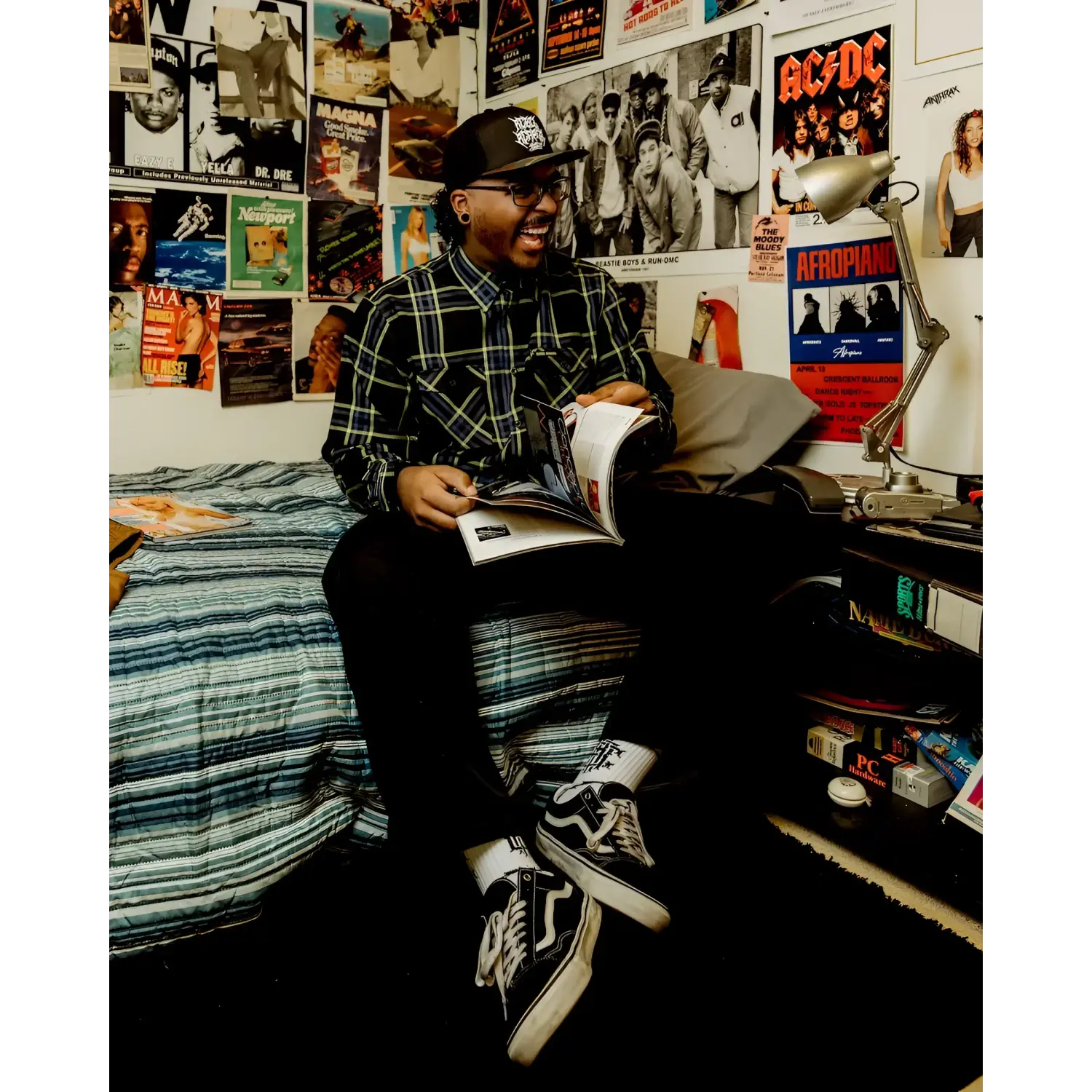 Man reading magazine wearing Burton Men’s Flannel with hidden collar buttons and chest pocket slits