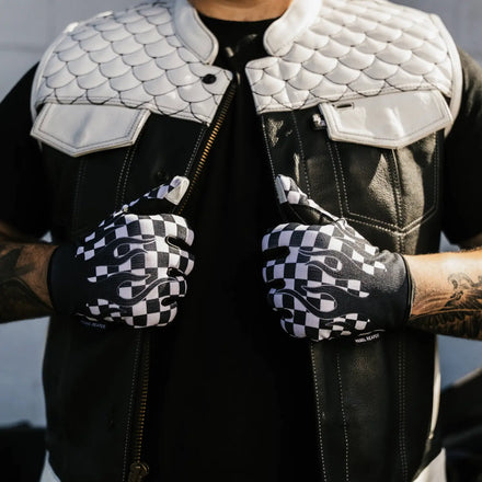 Black leather vest with white quilted shoulders and checkered flames moto gloves