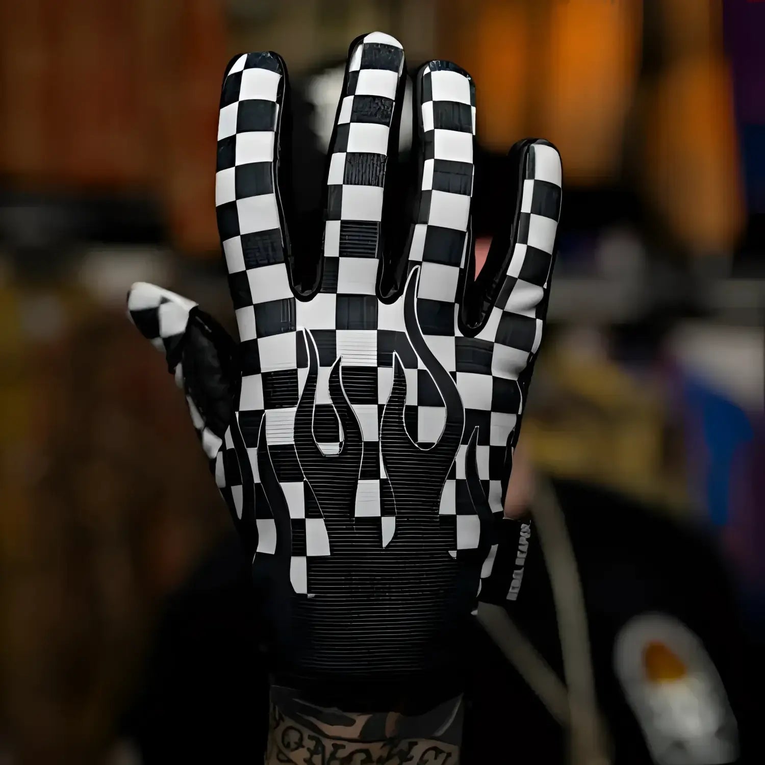 Checkered flames moto gloves featuring flame pattern and durable design