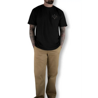 Man wearing black T-shirt and khaki chino pants with flex-tek stretch waistband in Rebel Reaper collection