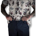 Tattooed person wearing navy blue chino pants with hidden stash pocket and flex-tek stretch waistband