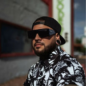 Man wearing Dana Retro Squared sunglasses from the Rebel Reaper collection with UV400 protection