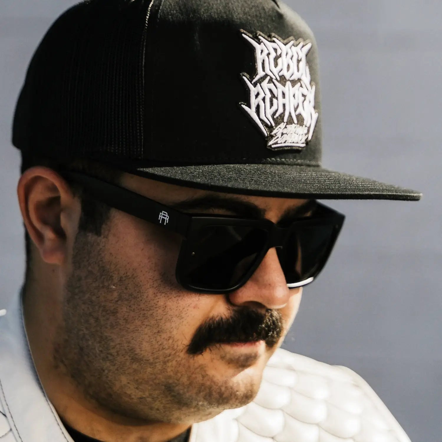 Black Dillinger Squared baseball cap with logo, interchangeable arms, and polarized lenses