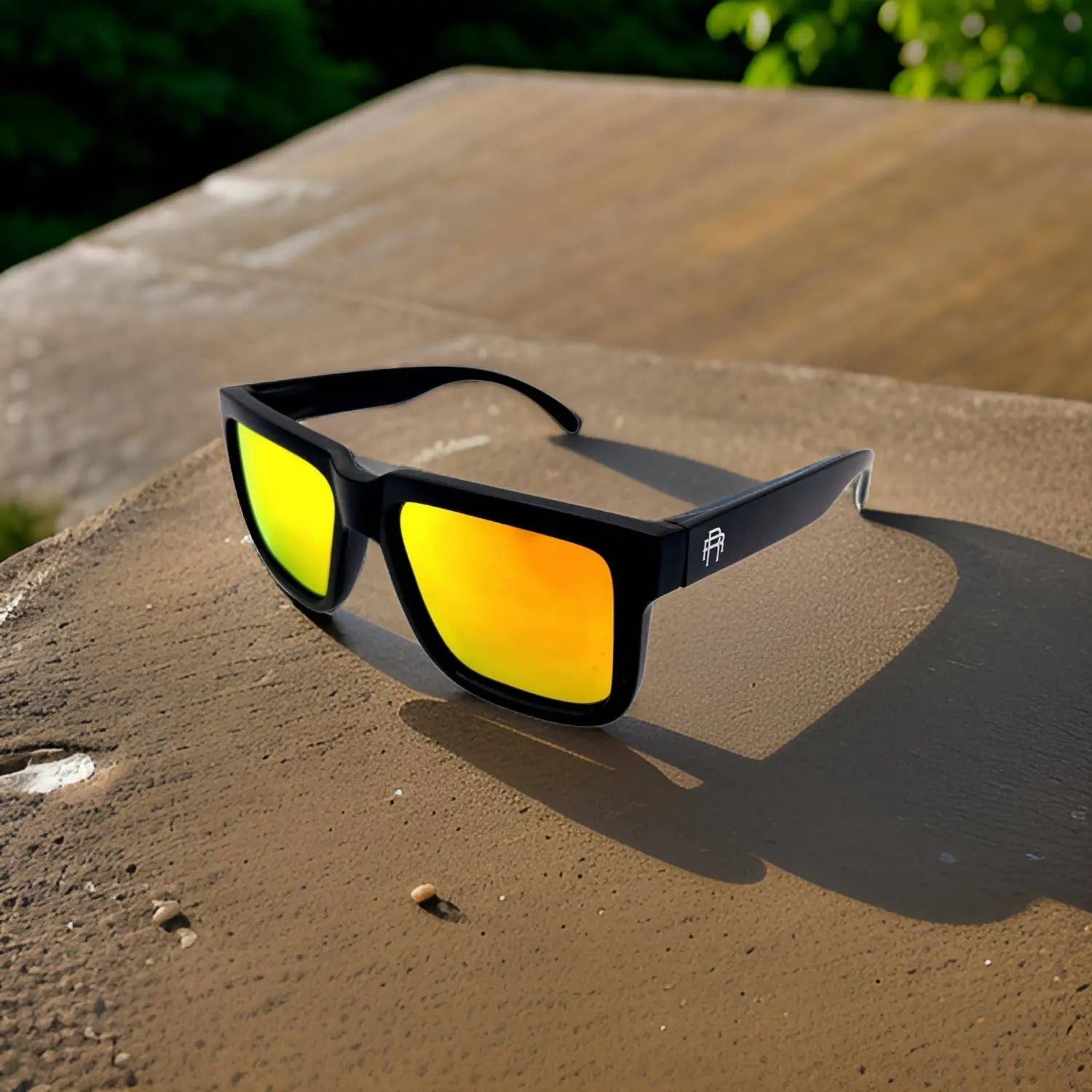 Black Dillinger Squared sunglasses with reflective orange polarized lenses and interchangeable arms