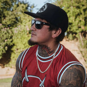 Man with tattoos wearing Dillinger Squared UV400 sunglasses with interchangeable arms and polarized lenses