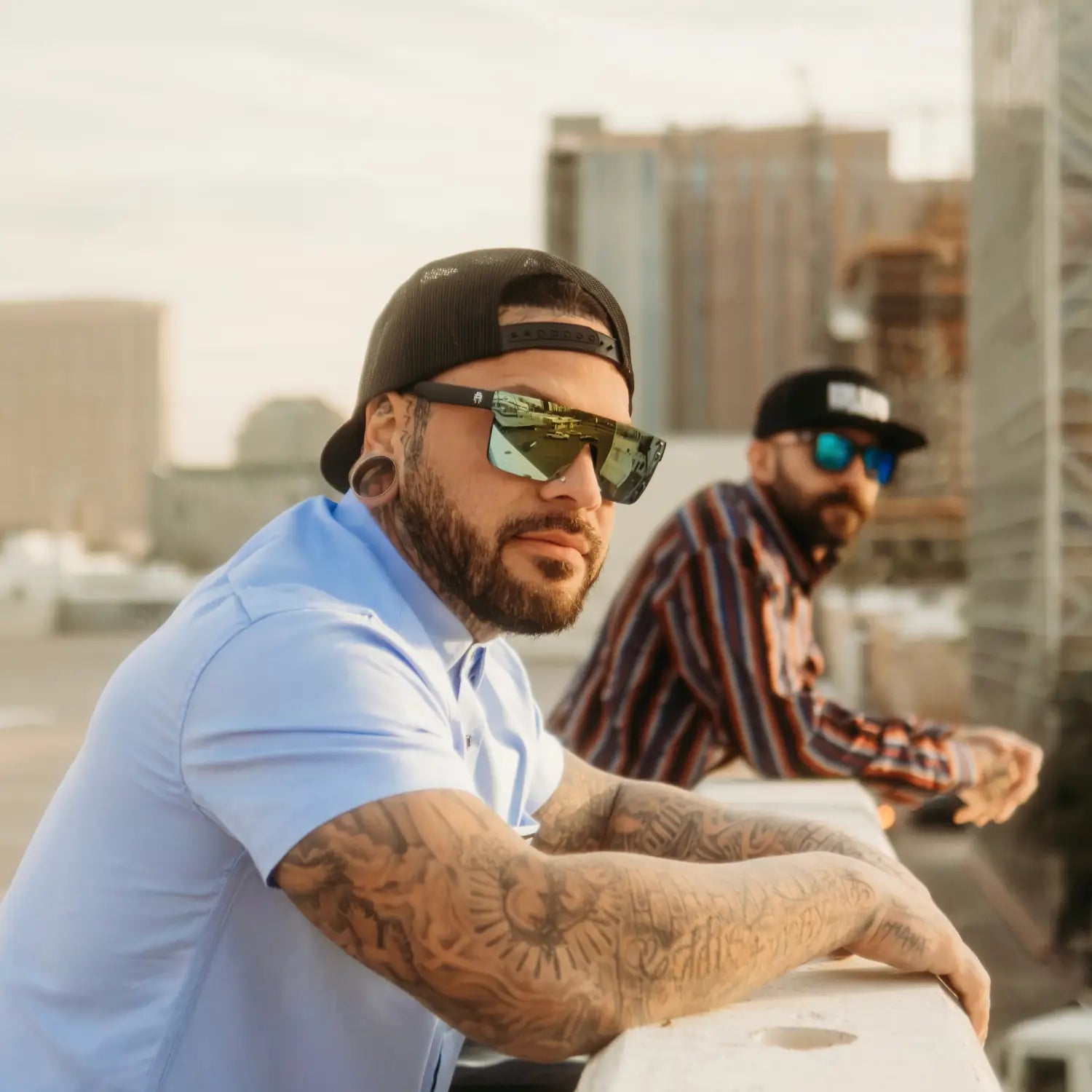 Two men wearing Flair Polarized Sunglasses from the Rebel Reaper Tattoo Flash Collection