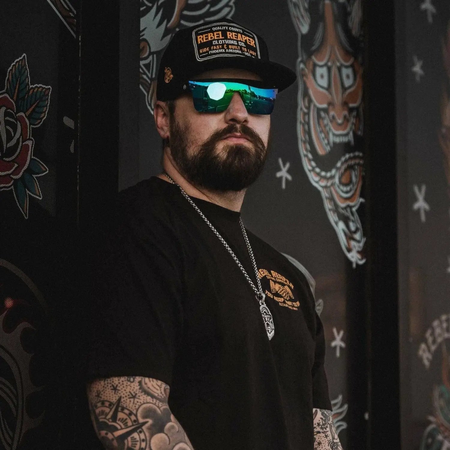 Man with beard tattoos and sunglasses from Flair Polarized Sunglasses Collection featuring Rebel Reaper style