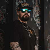 Man with beard tattoos and sunglasses from Flair Polarized Sunglasses Collection featuring Rebel Reaper style