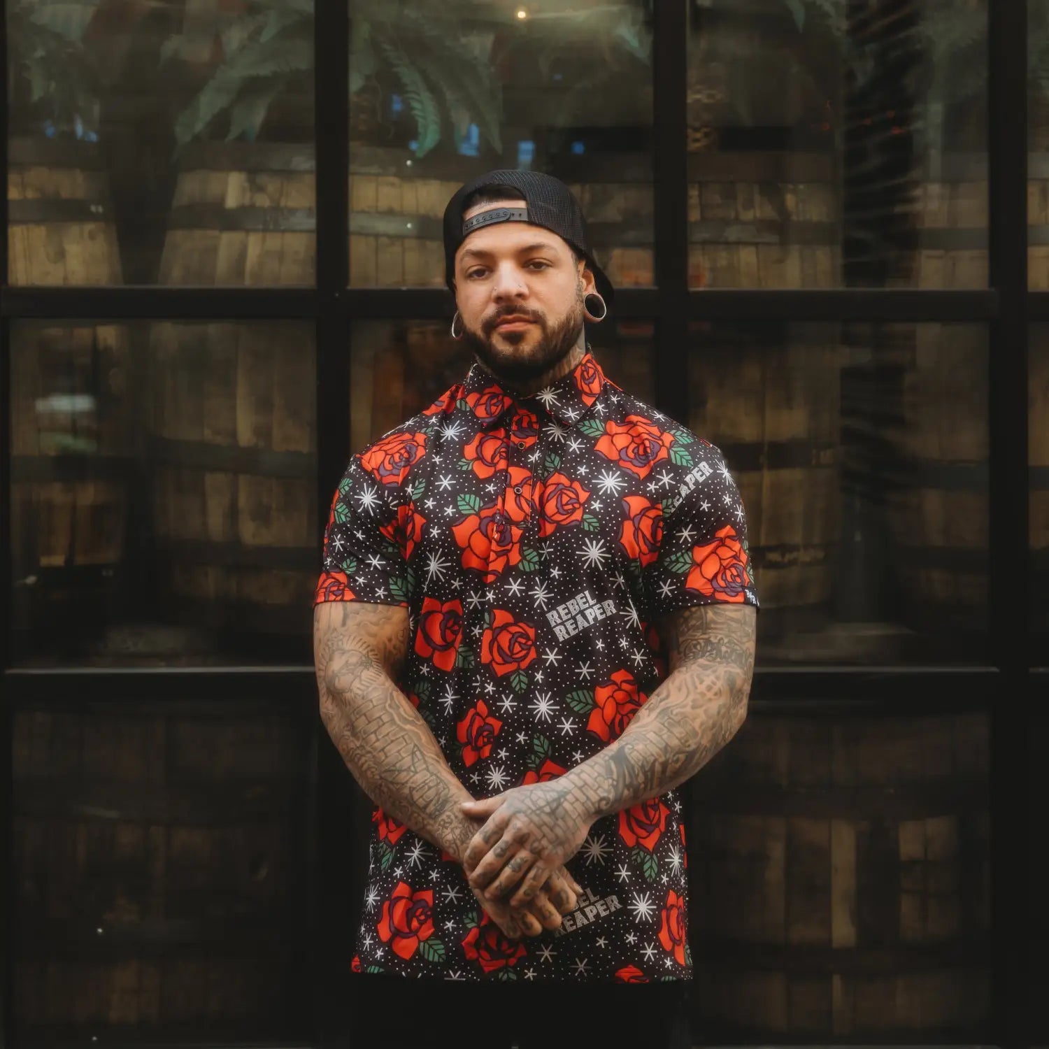 Man wearing Flash of Roses Black Polo Shirt with roses premium polo design for casual outings