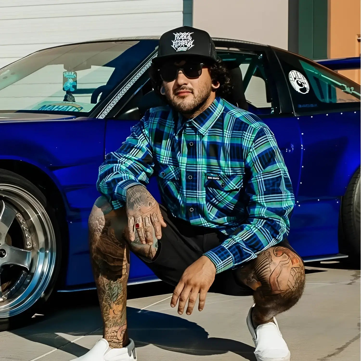 Tattooed man wearing men’s Frostbite Flannel with durable fabric and rebel reaper design