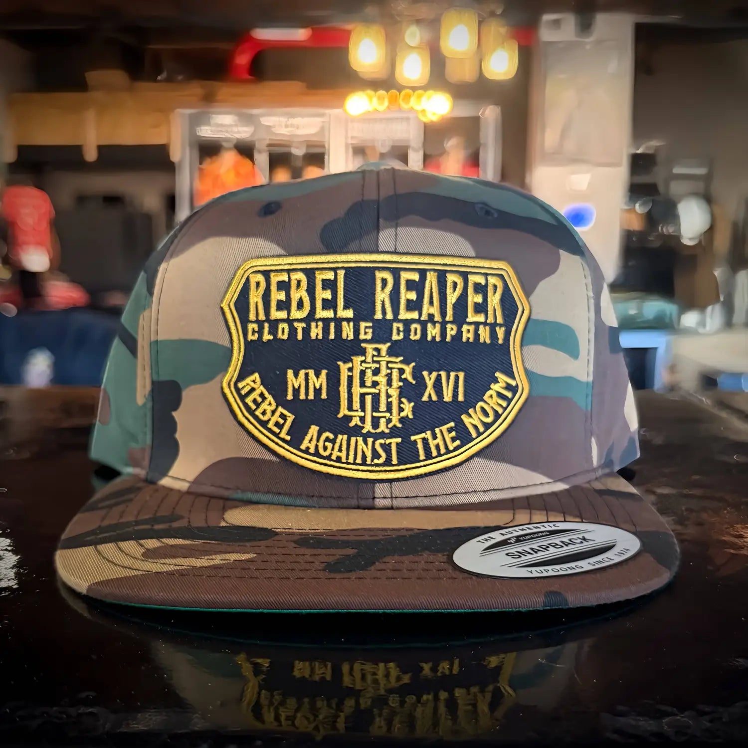 Camo Rebel Reaper hat with Gold Badge on a stylish Camo Snapback Hat