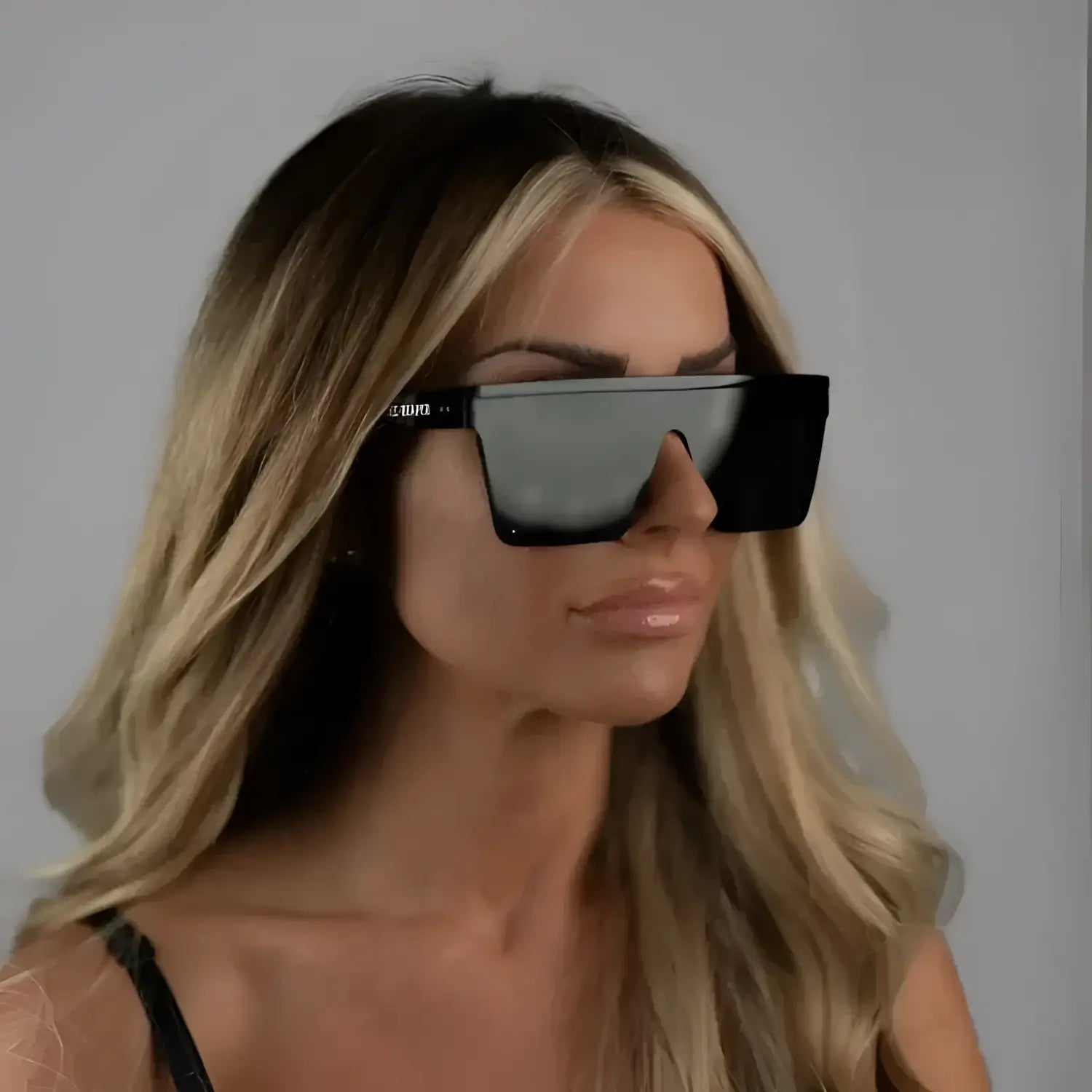 Oversized black sunglasses from OG Square Reflective UV400 Sunglass Collection with durable black frame