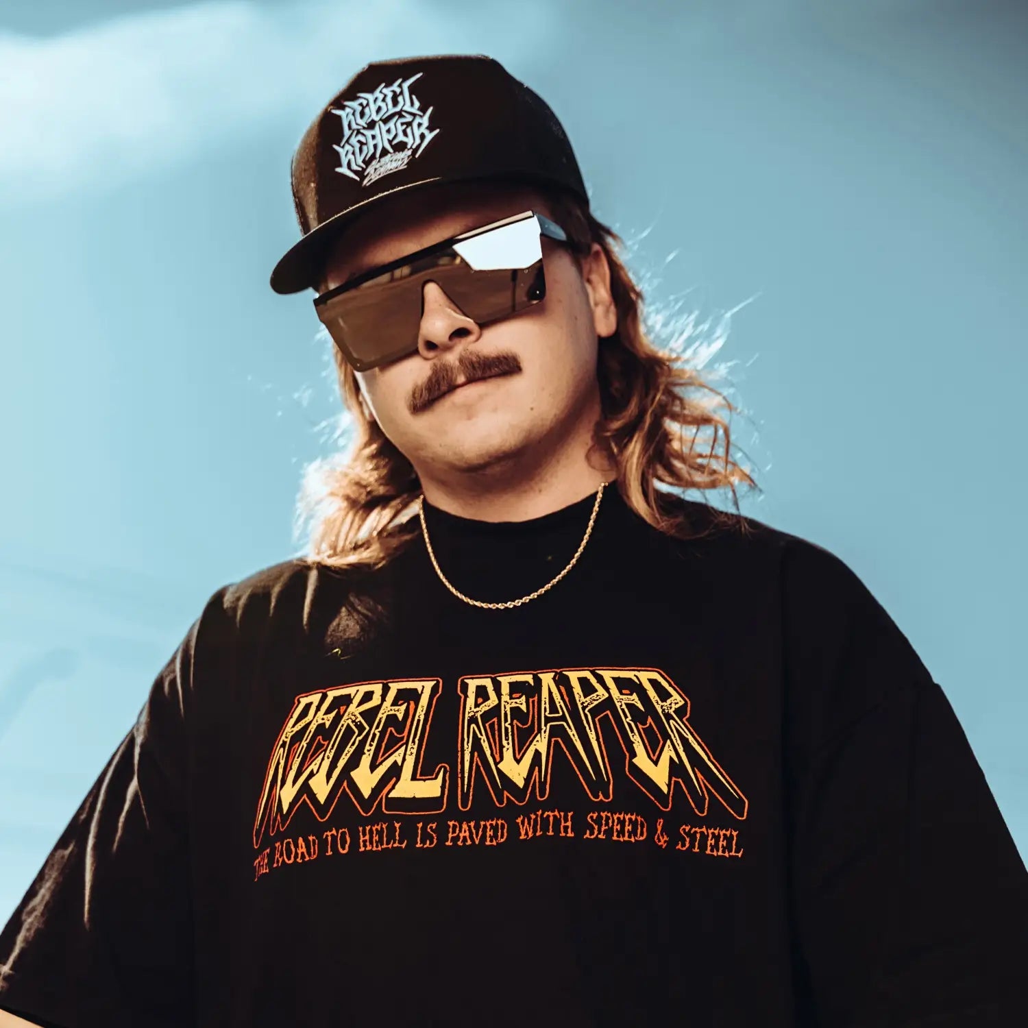 Man wearing Rebel Reaper tattoo apparel with UV400 protection sunglasses and durable black frame