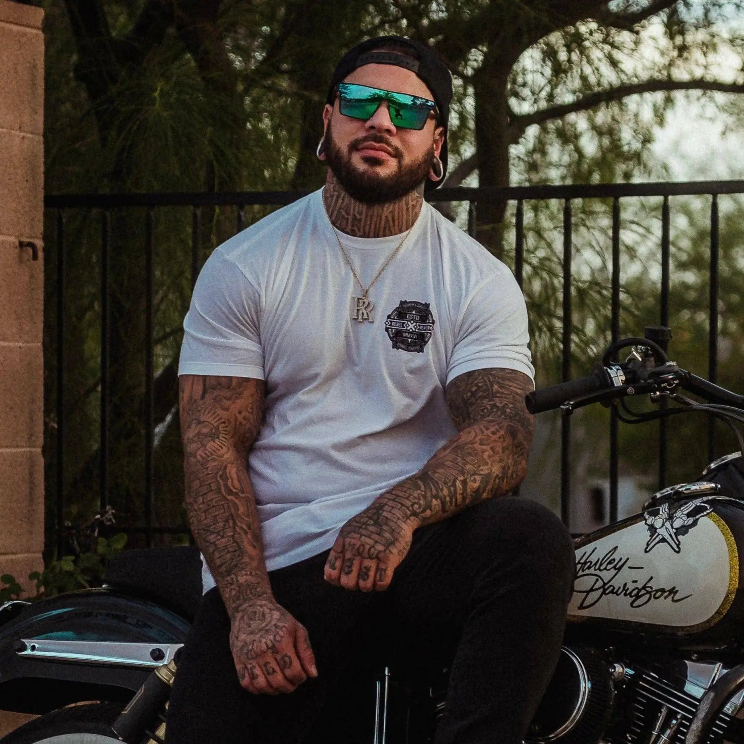 Tattooed man on motorcycle wearing Party Shade Polarized Aviator Sunglasses with durable TR90 frame and UV400 protection