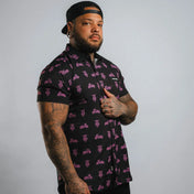 Pink Neon Moto Button Up Shirt featuring black motorcycle pattern with wrinkle-resistant fabric and hidden collar buttons for a polished appearance