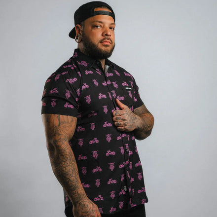 Pink Neon Moto Button Up Shirt featuring black motorcycle pattern with wrinkle-resistant fabric and hidden collar buttons for a polished appearance