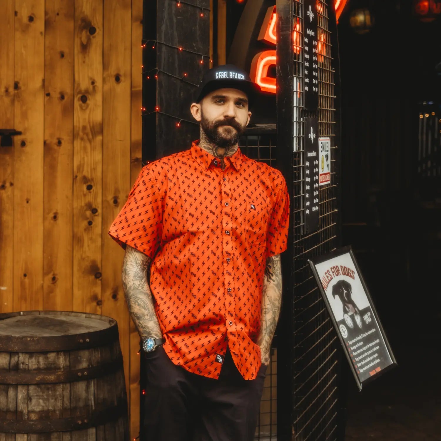 Man in patterned orange shirt with hidden collar buttons from Red Iconic Bolts collection