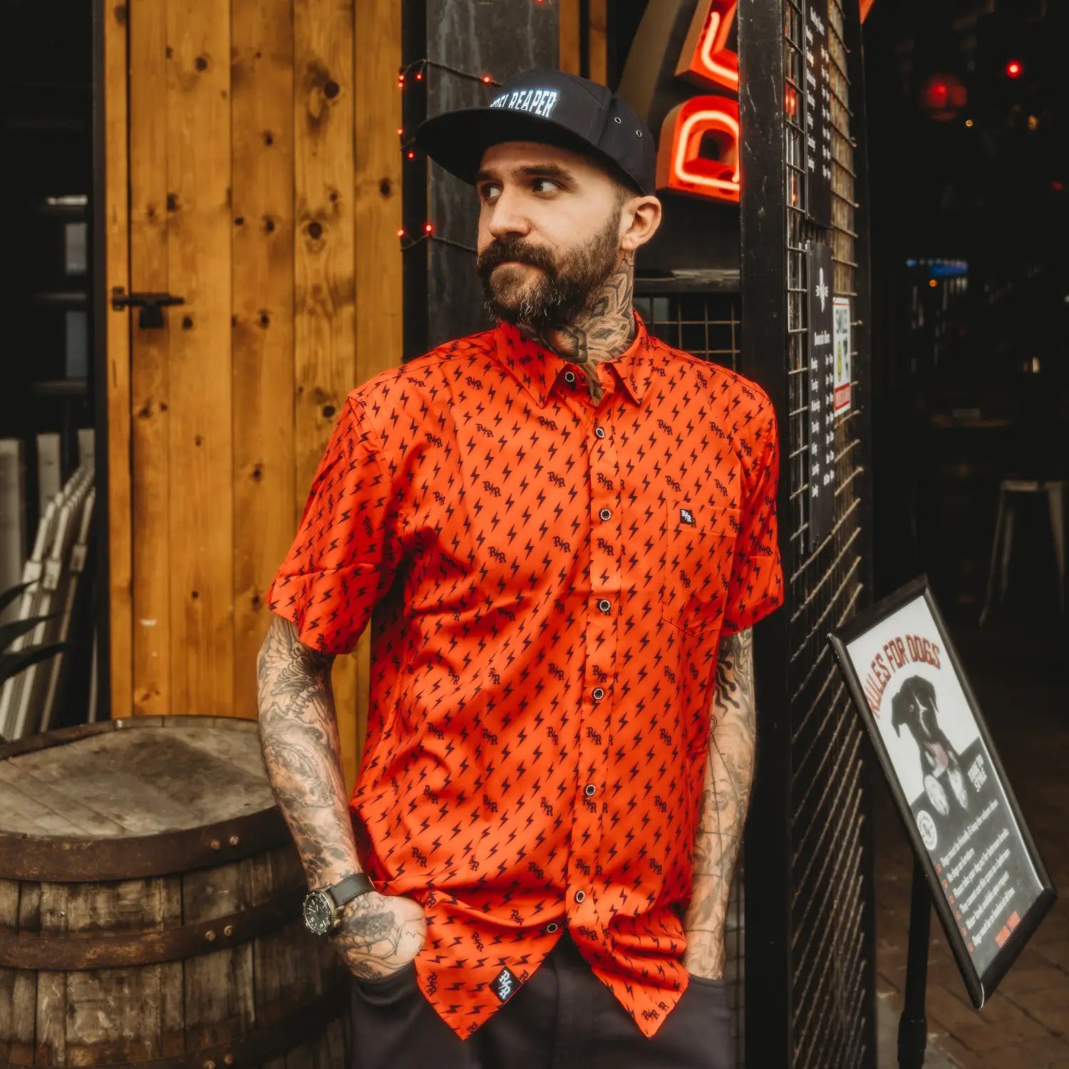 Man in patterned orange shirt with hidden collar buttons from Red Iconic Bolts collection