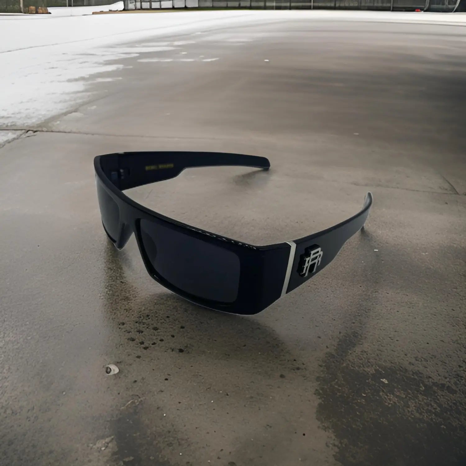 Black sunglasses with Rebel Reaper Monogram logo from the Metal Rebel Reaper Polarized Sunglass Collection