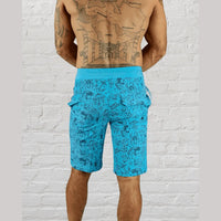 Blue patterned tattoo flash boardshorts made from eco-conscious fabric with velcro pockets