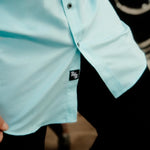 Light blue bamboo short sleeve button-up shirt with hidden collar buttons and wrinkle-resistant fabric