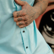 Light blue bamboo short sleeve button-up shirt with hidden collar buttons and wrinkle-resistant fabric