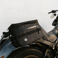 Black motorcycle saddlebag from The Doom Slinger Saddlebags with hidden waterproof pockets