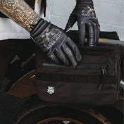 Black motorcycle saddlebag from The Doom Slinger Saddlebags with hidden waterproof pockets