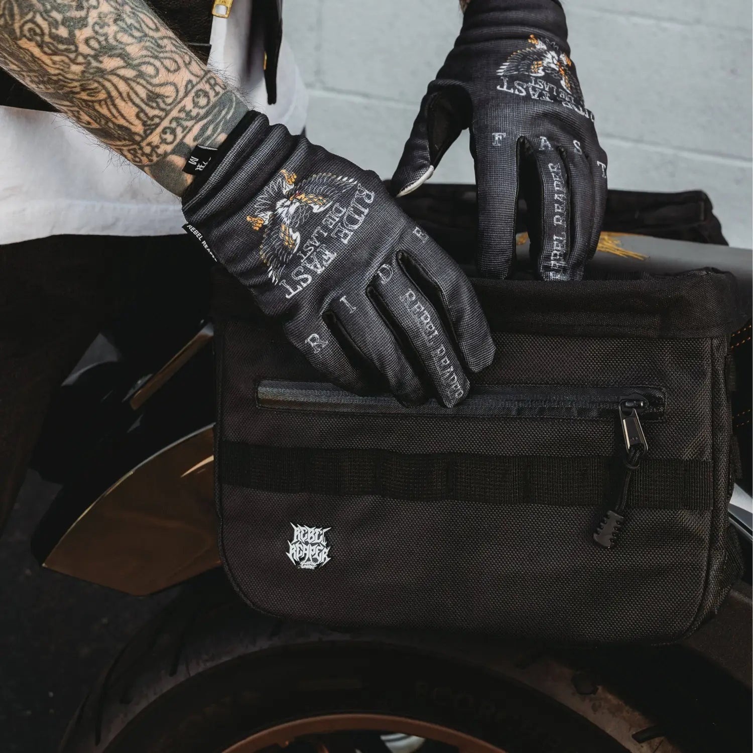 Black motorcycle saddlebag from The Doom Slinger Saddlebags with hidden waterproof pockets
